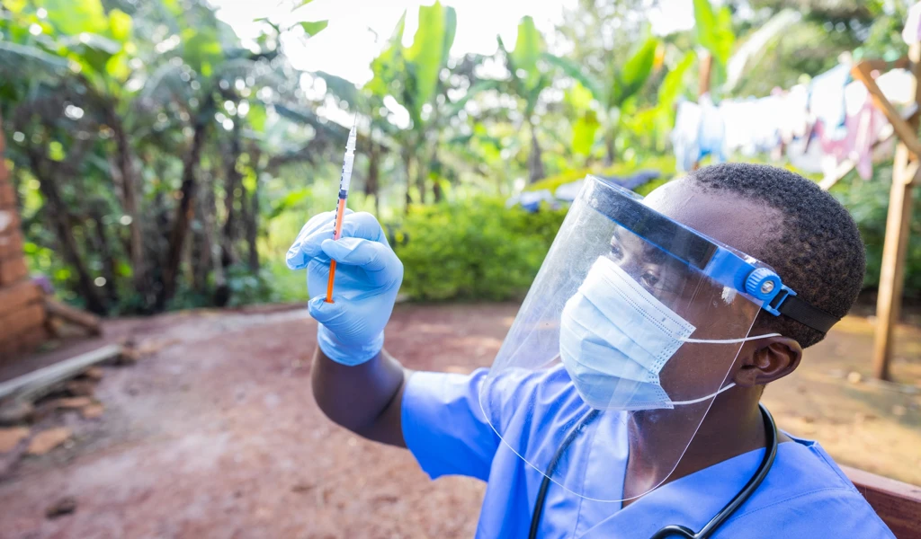 A person wearing PPE outdoors