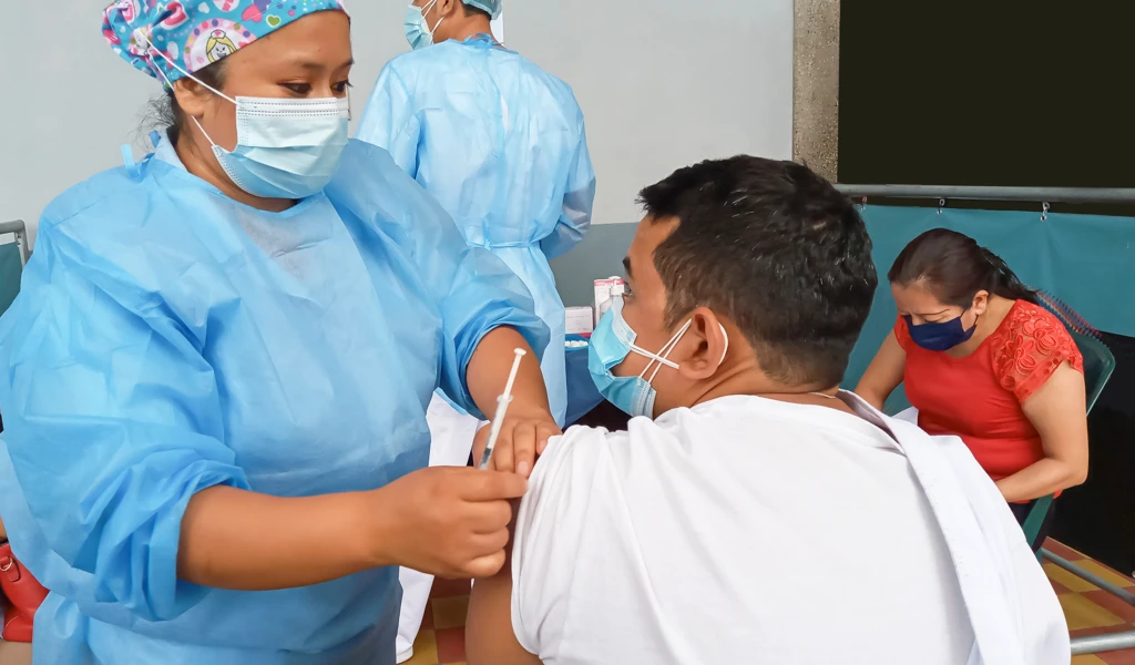 Nurse preparing to vaccinate person