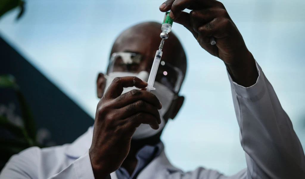 Man holding vaccine